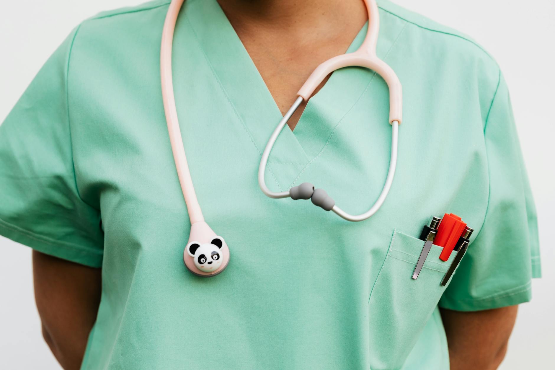 a doctor in a scrub suit with a stethoscope