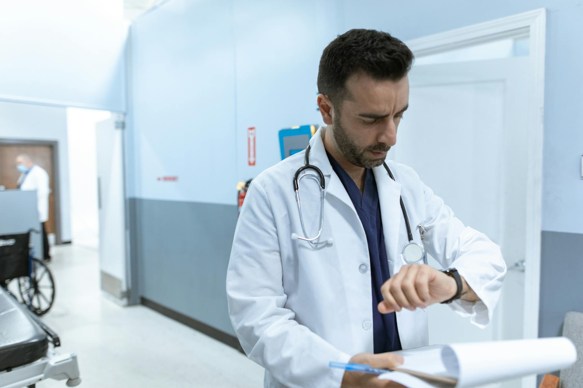 doctor looking at his wristwatch